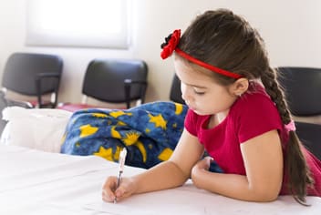 Young girl writing