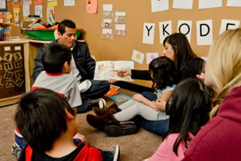 Family reading in classroom