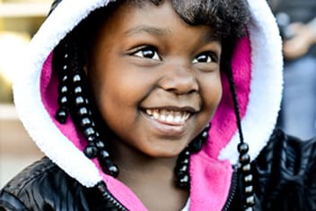 Little girl smiling in hoodie