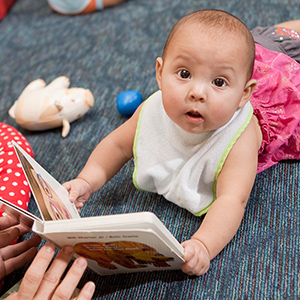 Baby holding book