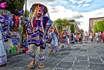 Person in traditional cultural dress on the street