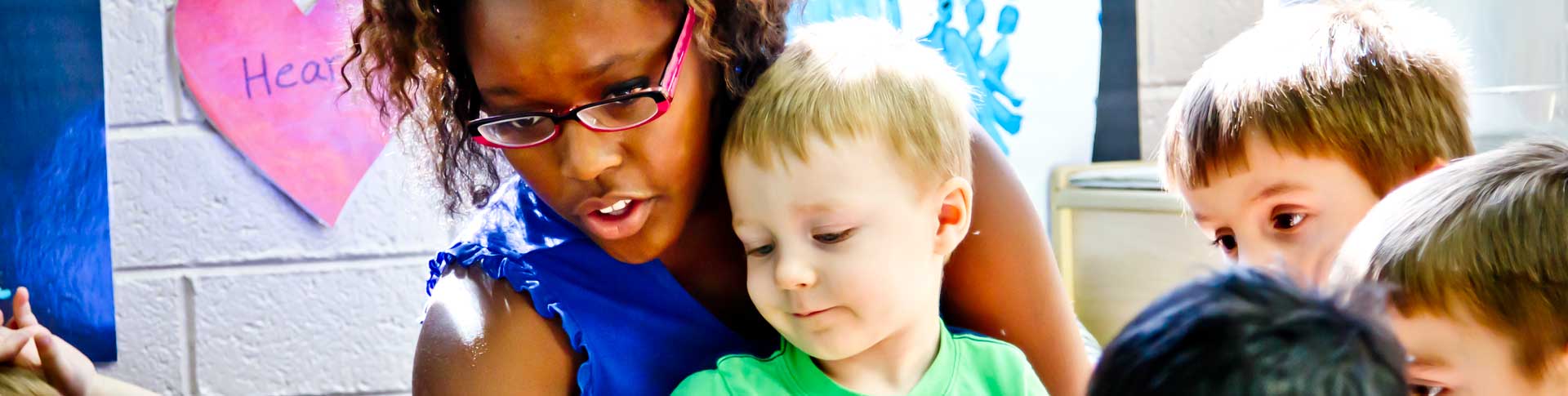 a Volunteer woman teaching the children at southwest human development